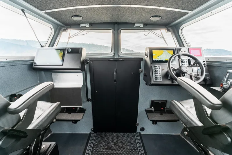  Yacht Photos Pics Interior of 2023 Liquid Metal Marine Maquinna Crew boat with modern navigation equipment.