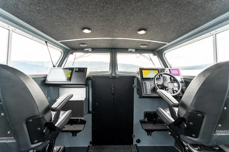  Yacht Photos Pics Interior of 2023 Liquid Metal Marine Maquinna Crew boat with modern navigation equipment.