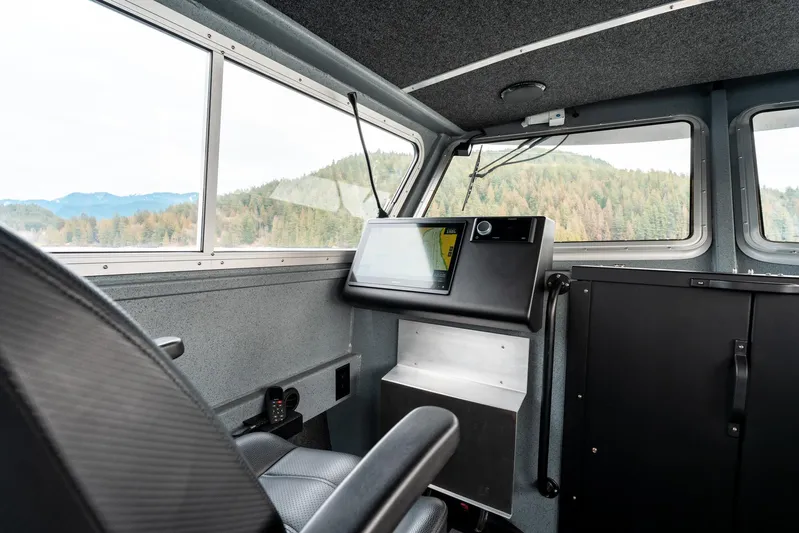  Yacht Photos Pics Interior of 2023 Liquid Metal Marine Maquinna Crew boat with control panel and scenic view.