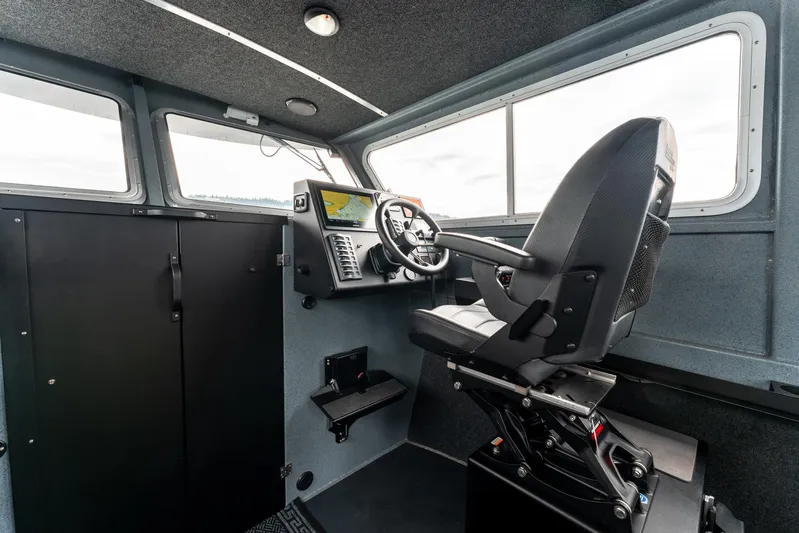  Yacht Photos Pics Interior of 2023 Liquid Metal Marine Maquinna Crew boat with modern controls and seating.