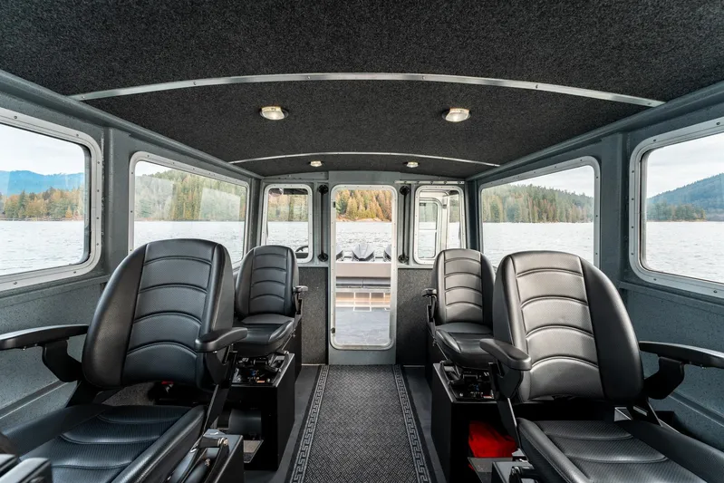  Yacht Photos Pics Interior of 2023 Liquid Metal Marine Maquinna Crew boat with four black seats.