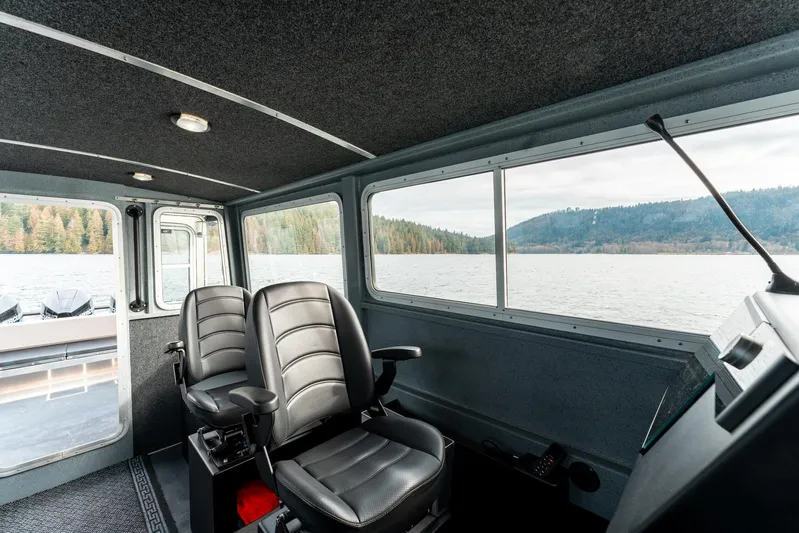  Yacht Photos Pics Interior of 2023 Liquid Metal Marine Maquinna Crew boat with scenic lake view.