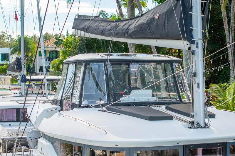 Going Deeper Yacht Photos Pics 2024 Lagoon 51 yacht with sleek design and modern features, docked in a marina.