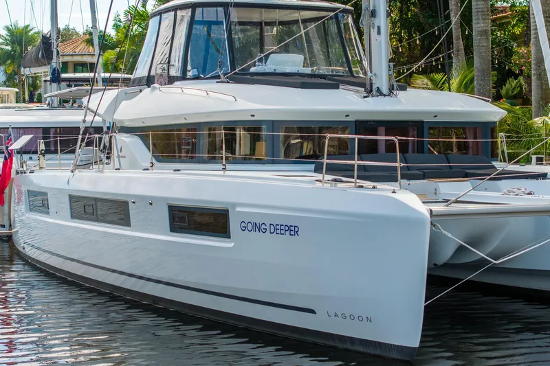 Going Deeper Yacht Photos Pics 2024 Lagoon 51 catamaran docked, featuring sleek design and modern amenities.