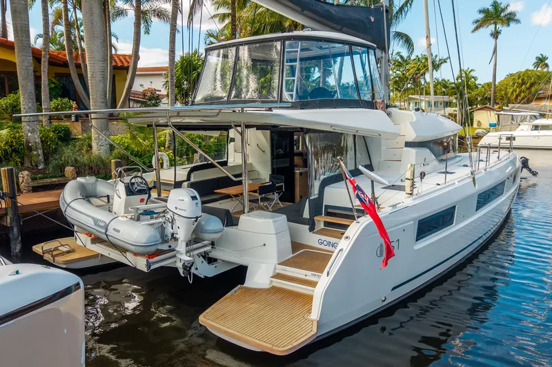 Going Deeper Yacht Photos Pics 2024 Lagoon 51 yacht docked, featuring spacious deck and modern design.