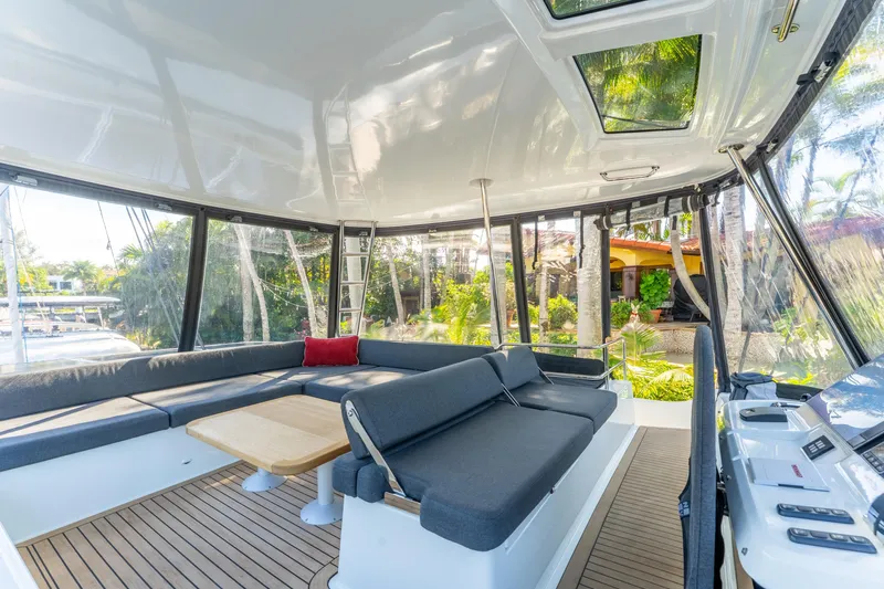 Going Deeper Yacht Photos Pics Luxurious 2024 Lagoon 51 yacht interior with spacious seating and modern design.