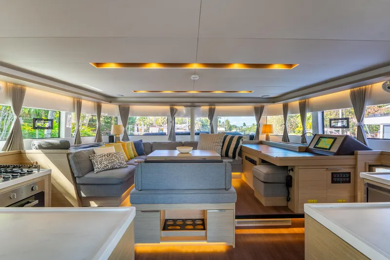 Going Deeper Yacht Photos Pics Luxurious interior of 2024 Lagoon 51 yacht with modern furnishings and ambient lighting.