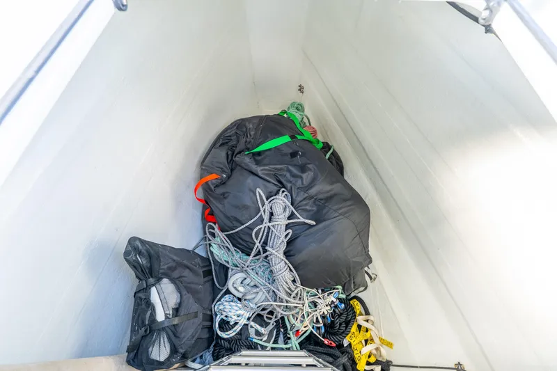 Going Deeper Yacht Photos Pics Storage compartment of 2024 Lagoon 51 yacht with ropes and gear.