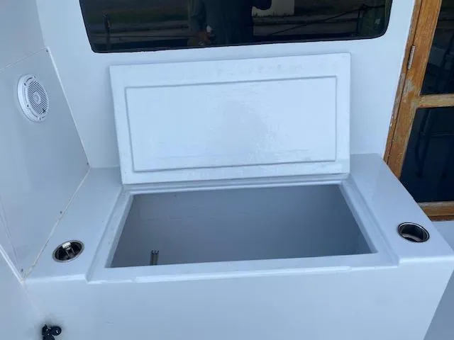 Cost Of Living Yacht Photos Pics Open storage compartment on 1985 Bertram 38 Convertible boat deck.