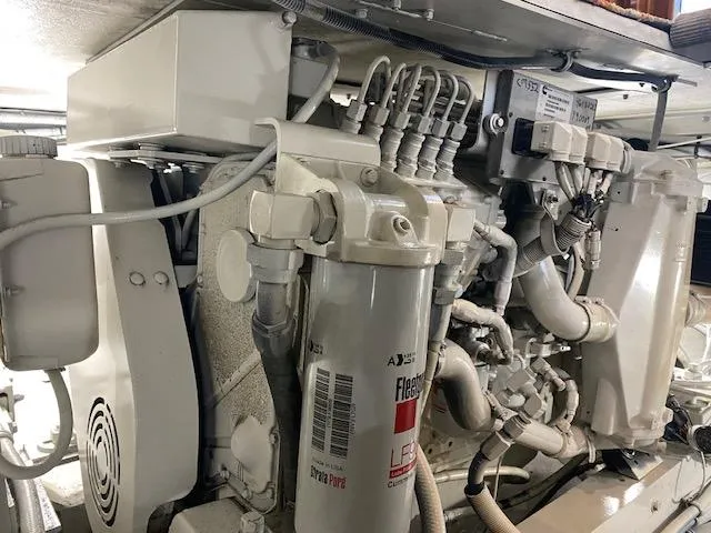 Cost Of Living Yacht Photos Pics Engine room of 1985 Bertram 38 Convertible boat, showcasing mechanical components and wiring.