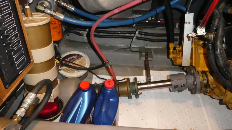  Yacht Photos Pics Engine room of a 1995 Riviera Convertible with oil containers and mechanical components.