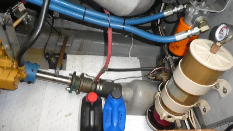  Yacht Photos Pics Engine compartment of a 1995 Riviera Convertible with hoses, filters, and fluid containers.