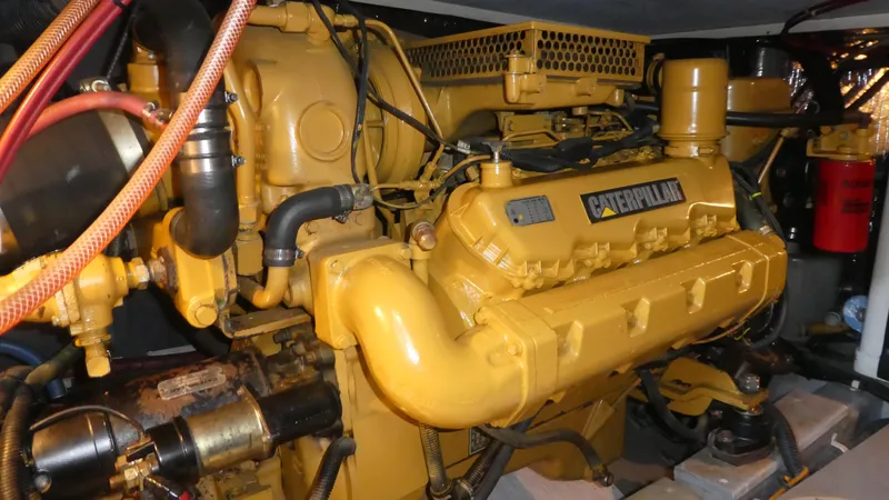  Yacht Photos Pics Caterpillar engine in a 1995 Riviera Convertible, showcasing detailed mechanical components.