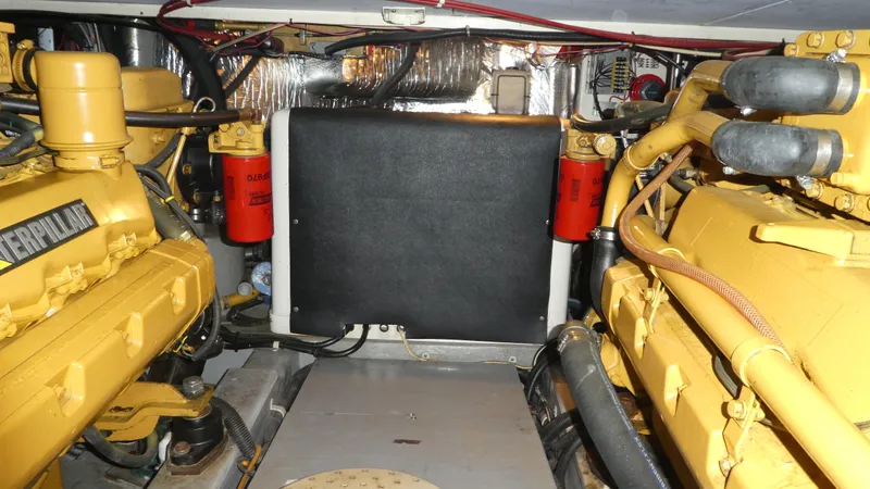  Yacht Photos Pics Engine room of a 1995 Riviera Convertible with Caterpillar engines and visible components.