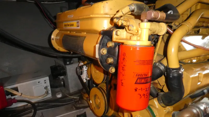  Yacht Photos Pics Engine compartment of a 1995 Riviera Convertible with CAT power system and Baldwin filter.