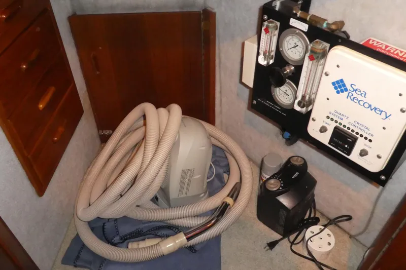  Yacht Photos Pics 1995 Riviera Convertible interior with Sea Recovery system and coiled hose.