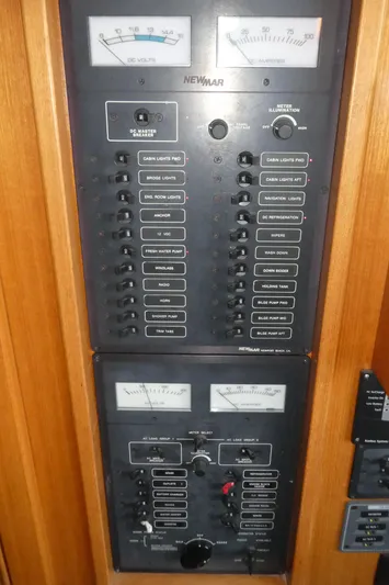  Yacht Photos Pics Electrical control panel on a 1995 Riviera Convertible boat, featuring various switches and meters.