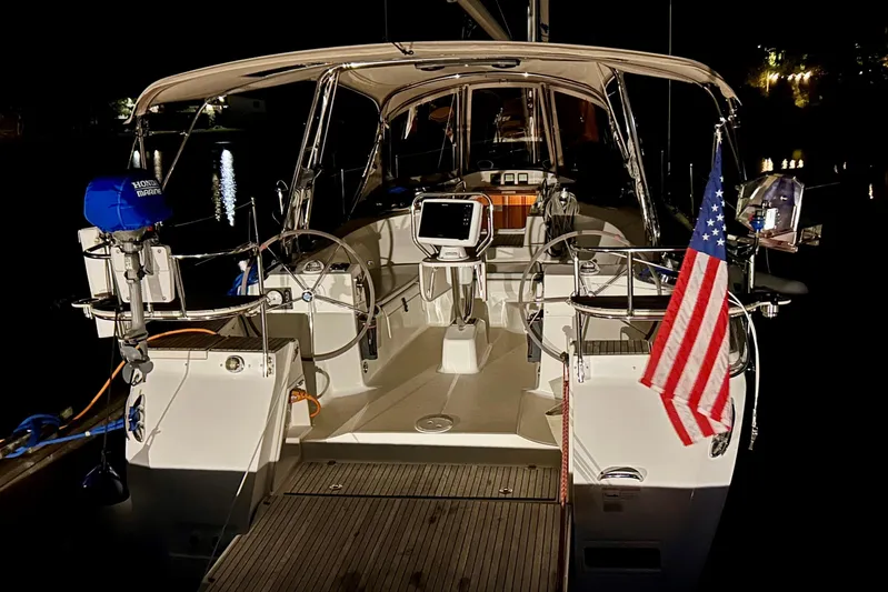 Sage Yacht Photos Pics 2016 Marlow-Hunter 40 sailboat at night, featuring dual steering wheels and American flag.