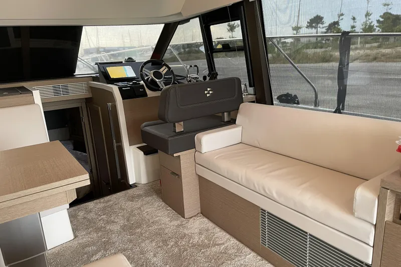  Yacht Photos Pics Luxurious interior of 2020 Prestige 420 yacht with modern helm and comfortable seating.