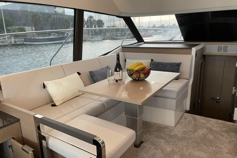  Yacht Photos Pics Luxurious interior of 2020 Prestige 420 yacht with elegant seating and dining area.