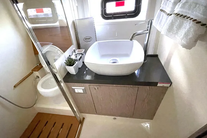  Yacht Photos Pics 2024 Sessa Marine F42 Flybridge bathroom with modern sink and toilet.