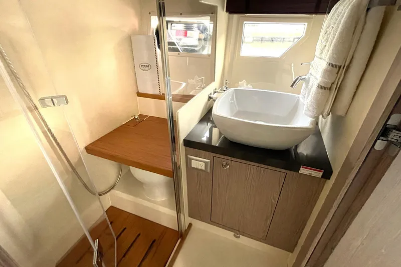  Yacht Photos Pics 2024 Sessa Marine F42 Flybridge bathroom with modern sink and shower.
