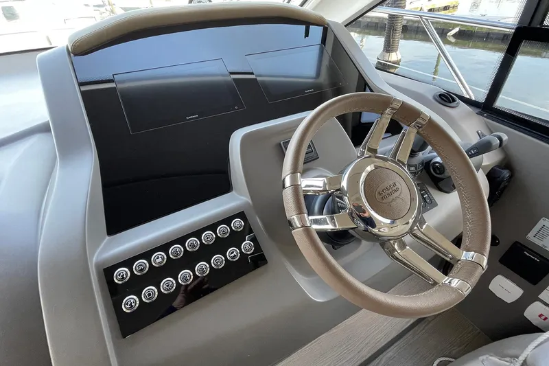  Yacht Photos Pics 2024 Sessa Marine F42 Flybridge helm with modern steering wheel and control panel.