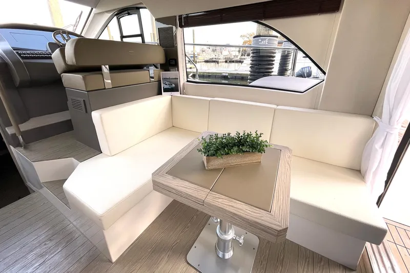  Yacht Photos Pics Luxurious interior of 2024 Sessa Marine F42 Flybridge yacht with elegant seating and table.