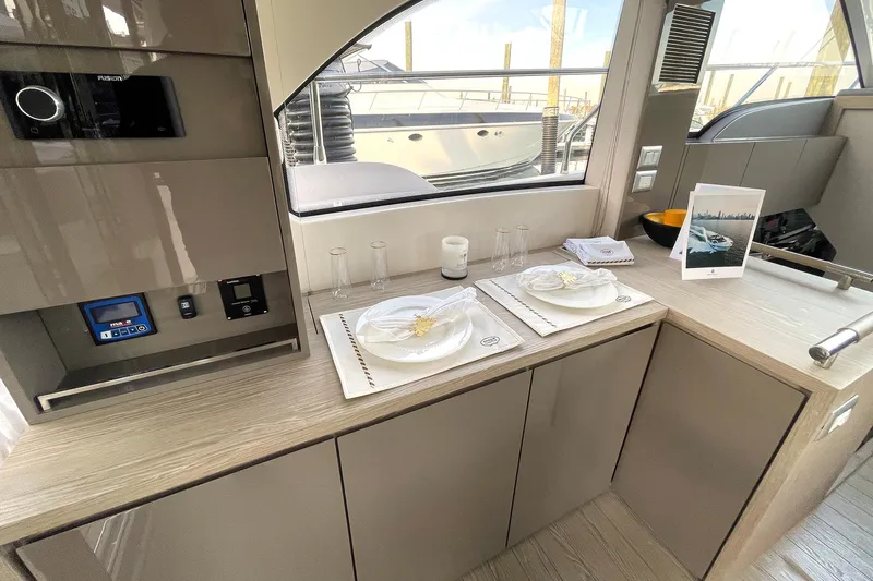  Yacht Photos Pics Interior of 2024 Sessa Marine F42 Flybridge yacht with elegant dining setup.