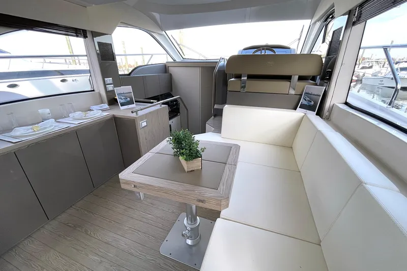  Yacht Photos Pics Luxurious interior of 2024 Sessa Marine F42 Flybridge yacht with modern seating and table.