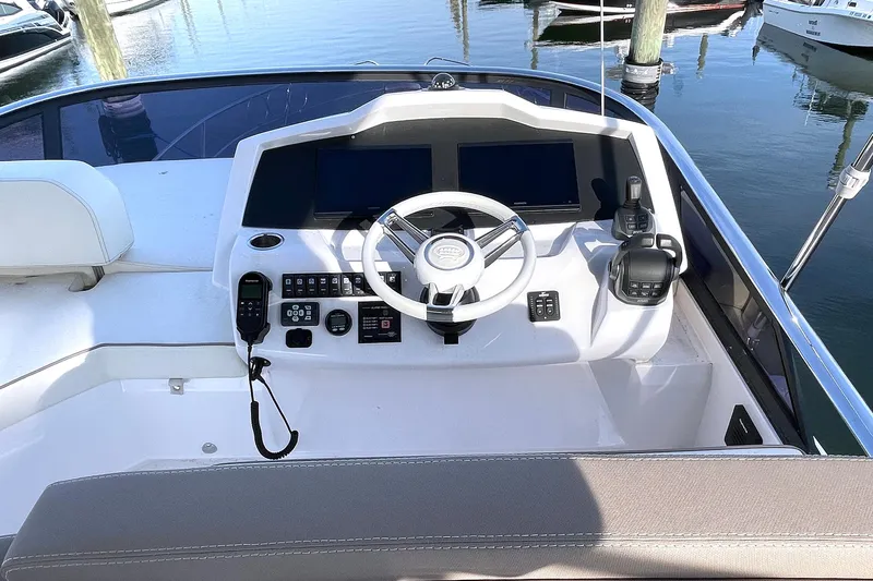  Yacht Photos Pics Flybridge helm of 2024 Sessa Marine F42, featuring modern controls and navigation equipment.