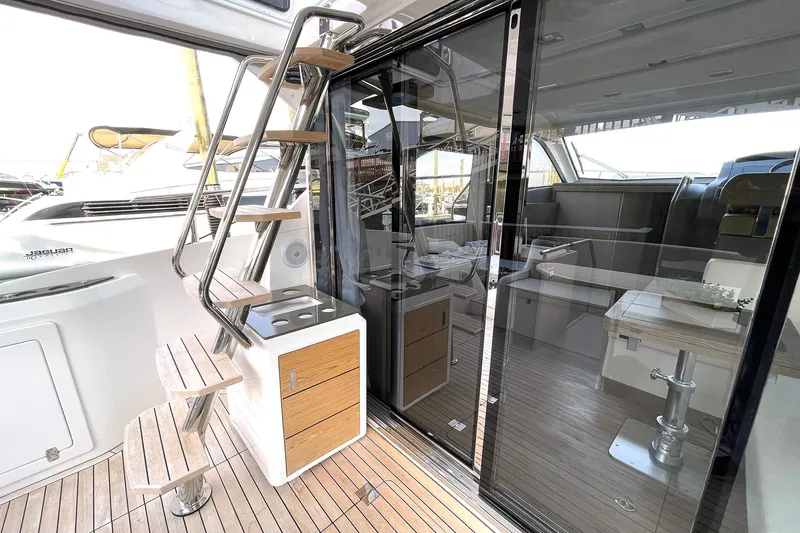  Yacht Photos Pics 2024 Sessa Marine F42 Flybridge yacht interior with modern design and wooden flooring.