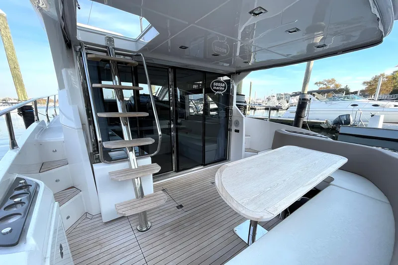 Yacht Photos Pics 2024 Sessa Marine F42 Flybridge yacht with sleek deck and modern seating area.