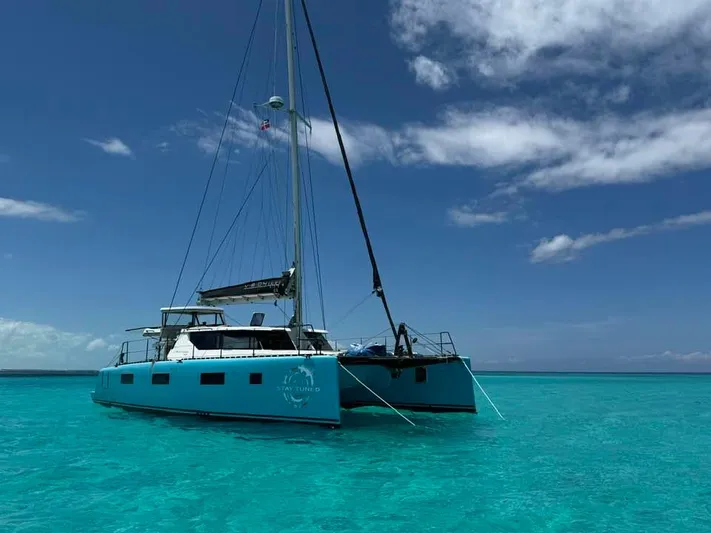 Vision 444es Yacht Photos Pics Vision 444 catamaran sailing in clear turquoise waters under a blue sky, 2025 model.
