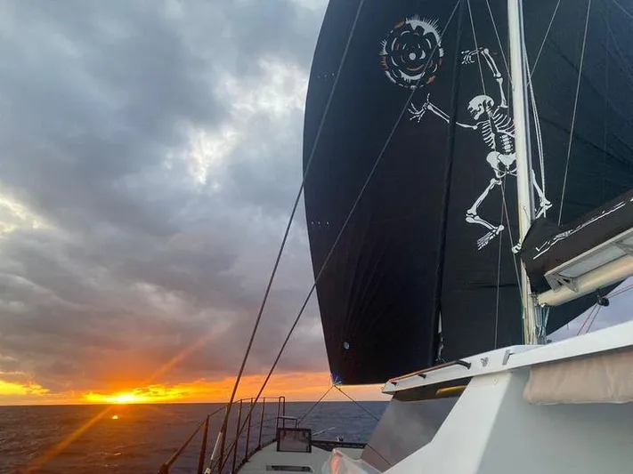 Vision 444es Yacht Photos Pics Sailing yacht Vision 444 at sunset with skeleton-themed sail, 2025 model.