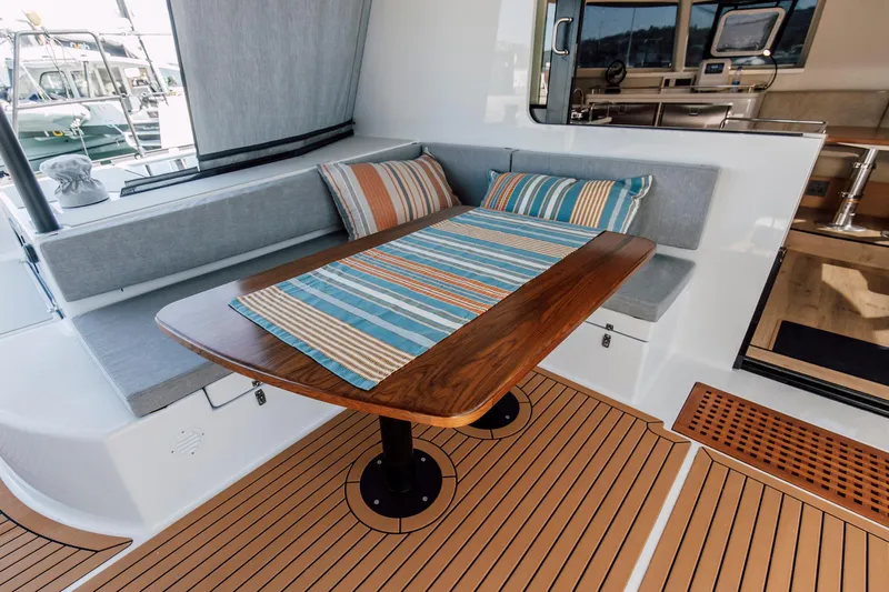 Vision 444es Yacht Photos Pics Vision 444 2025 yacht interior with cozy seating and wooden table.