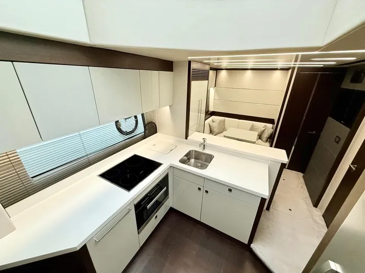  Yacht Photos Pics Interior of 2019 Sunseeker 74 Sport Yacht, modern kitchen and lounge.