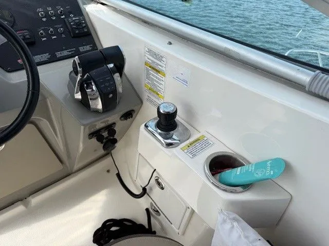 Bella Vida Yacht Photos Pics Helm of 2014 Sea Ray 310 Sundancer with controls and cup holder.