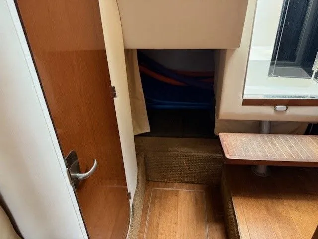 Bella Vida Yacht Photos Pics Interior cabin view of 2014 Sea Ray 310 Sundancer with wooden flooring and steps.