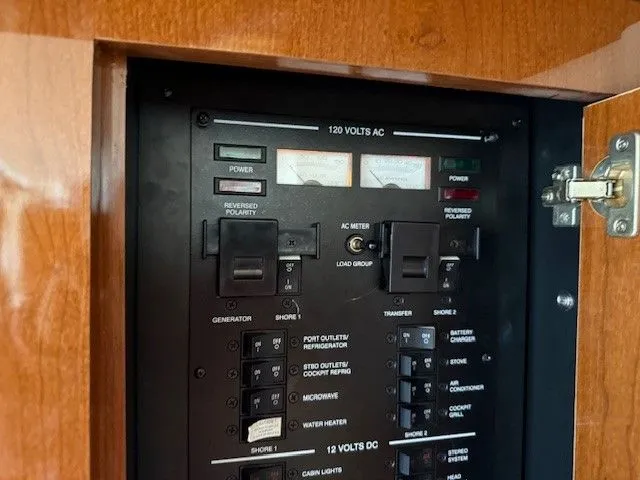 Bella Vida Yacht Photos Pics Electrical panel of 2014 Sea Ray 310 Sundancer boat, featuring various switches and meters.