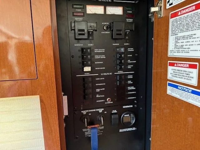 Bella Vida Yacht Photos Pics Electrical control panel on a 2014 Sea Ray 310 Sundancer boat.