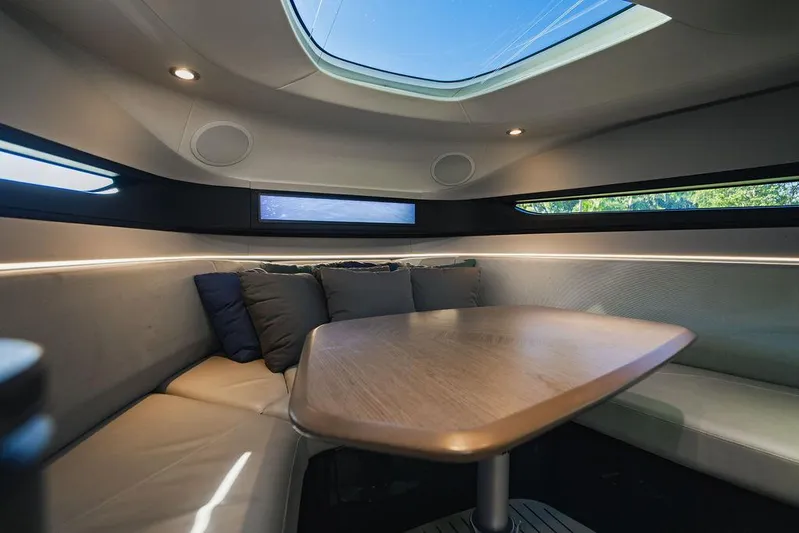 Little Princess Yacht Photos Pics Luxurious interior of 2020 Princess R35 yacht with elegant seating and skylight.