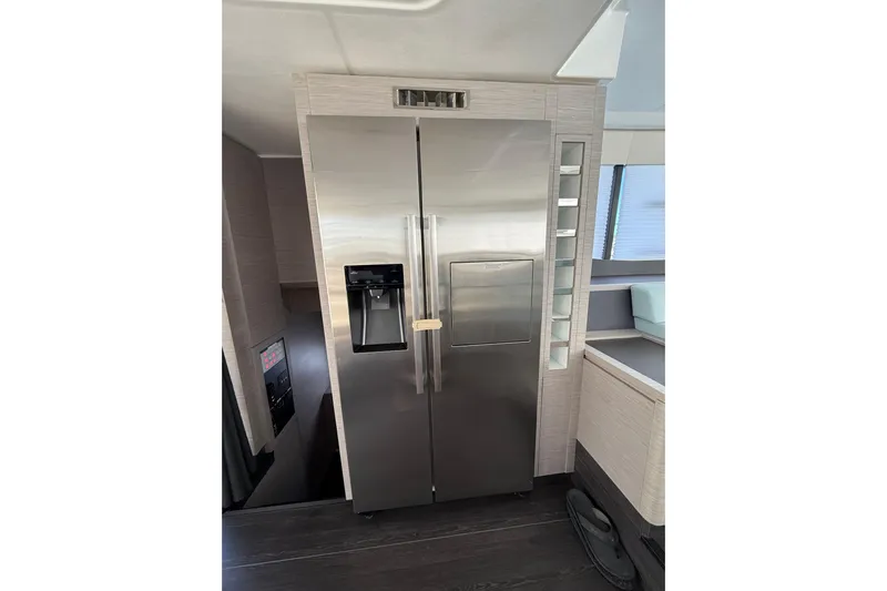  Yacht Photos Pics Modern kitchen with stainless steel refrigerator on 2024 Fountaine Pajot MY 44 yacht.