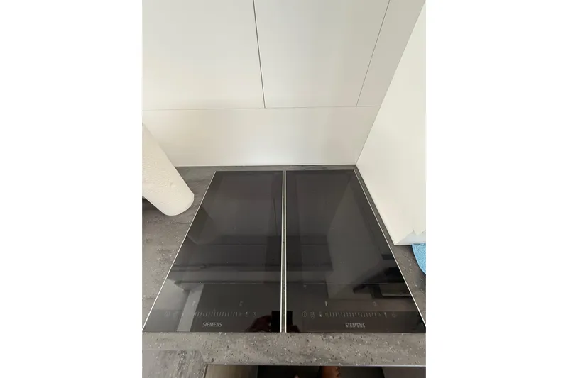  Yacht Photos Pics Modern Siemens induction cooktop on Fountaine Pajot MY 44 yacht, 2024 model.