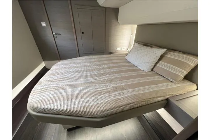 Yacht Photos Pics Luxurious bedroom interior of 2024 Fountaine Pajot MY 44 yacht with modern design.