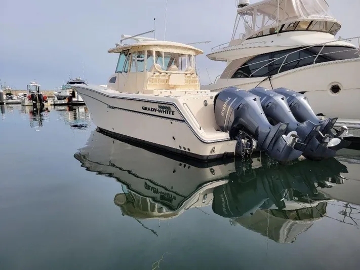  Yacht Photos Pics 2017 Grady-White 376 Canyon boat docked in a marina.
