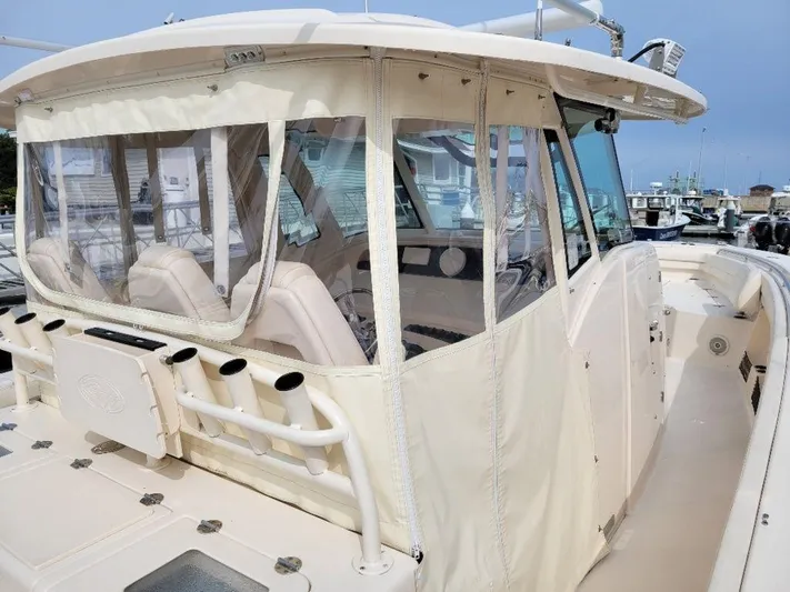  Yacht Photos Pics 2017 Grady-White 376 Canyon boat with enclosed helm at marina.
