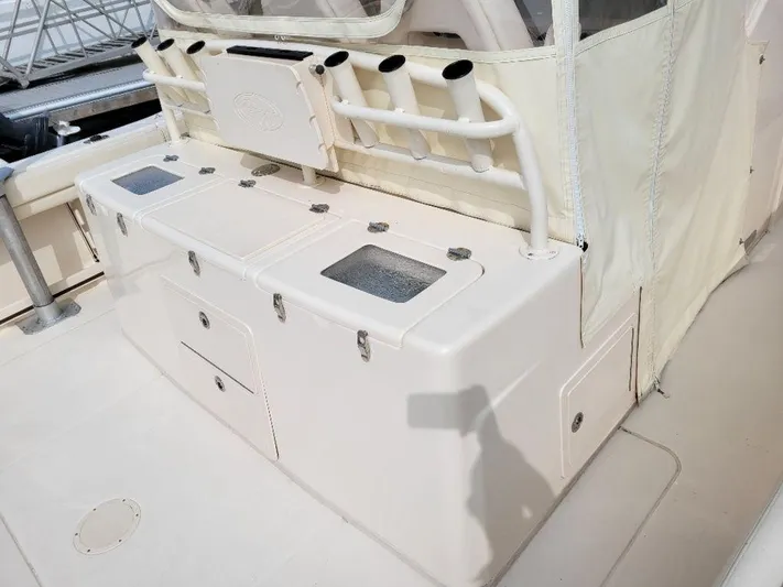  Yacht Photos Pics 2017 Grady-White 376 Canyon boat interior with storage compartments and rod holders.