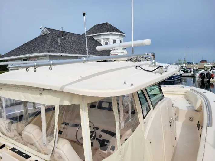  Yacht Photos Pics 2017 Grady-White 376 Canyon boat docked at a marina.