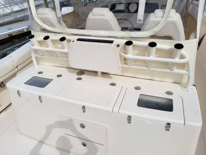  Yacht Photos Pics 2017 Grady-White 376 Canyon boat cockpit with rod holders and storage compartments.